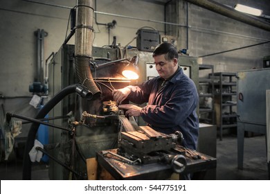 Man concentrating on his work at the factory