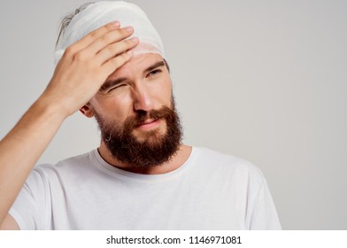   A Man Concussion With A Bandage On His Head.                             