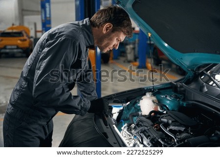 Man conducts full technical check of auto