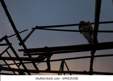 Man construction work on evening light