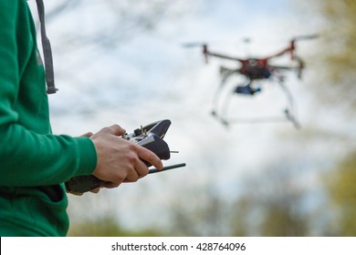 Man controling a drone.