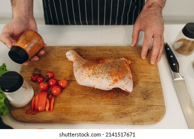 Man Cooking Chicken. сlose-up Portrait Of Cooking