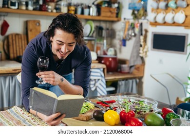 Man Cooking At His Kitchen