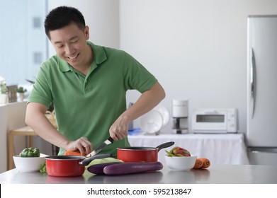 Man Cooking In The Kitchen