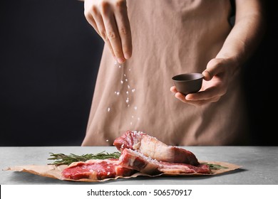 Man Cooking Meat Steak On Kitchen