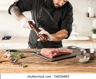 Man Cooking Meat Steak On Kitchen