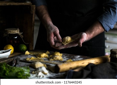 Man Cooking Pasta Ravioli. Chef's Hands