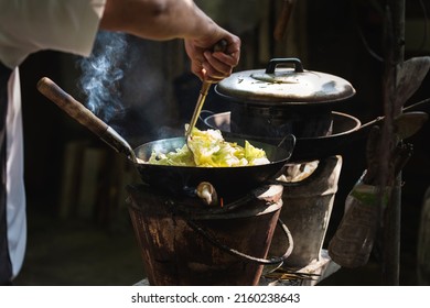 The Man Cooking Vegetables In Frying Pan On Vintage Stove ,cooking With Firewood ,cook By Myself For Eat In Home