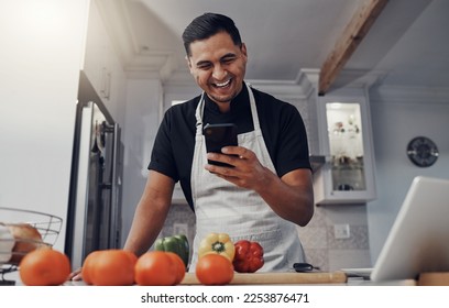 Man, cooking vegetables and phone for comic online recipe in kitchen with house wifi connection. Chef person with mobile app for learning or blog post for home food for vegan or healthy eating - Powered by Shutterstock