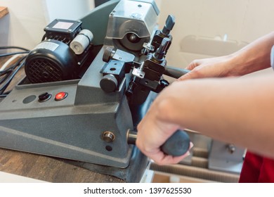 Man copying key using a machine