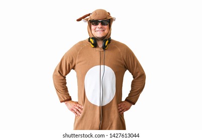 Man In Cosplay Costume Of A Cow Isolated On White Background. Guy In The Animal Pyjamas Sleepwear. Funny Photo With Party Ideas. Disco Retro Music.