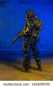 man cosplayer in a suit heavy infantry storm trooper in power armor on a blue background