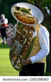 Man in costume playing the instrument Tuba
