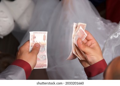 Man Counting Money With Your Hands. View From Above