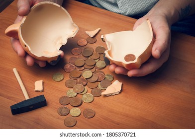 Man Counting Savings From A Broken Piggybank