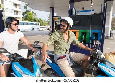 Man Couple On Gas Station Fuel Motor Bike, Happy Smiling Guys Travelling Buy Patrol - Powered by Shutterstock