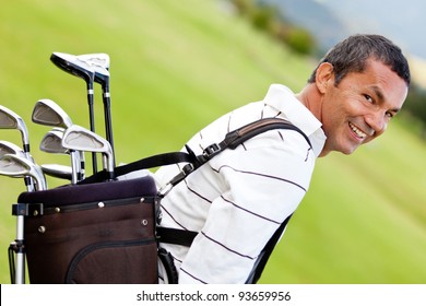 Man At The Course Carrying A Golf Bag