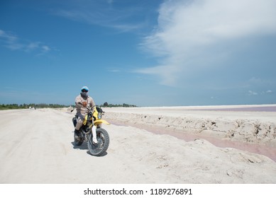 Man With The Covered Face On The Bike. Riding Throgh The Desert. Bike Adventures. Mexican Mafia.. Terrorist With Covered Face On The Bike. Post Apocalypse Concept. Mafia Concept. Motorcycle Traveling.