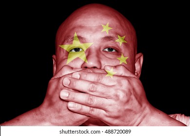 
A Man Covering His Mouth With His Hand With Imprint Of A Chinese Flag For The Concept: Freedom Of Speech In China.