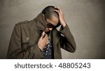 Man covers up and pops his jacket collar