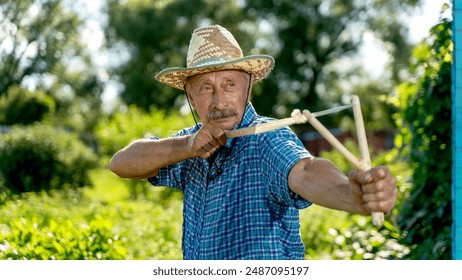 A man in a cowboy hat shoots from a slingshot - Powered by Shutterstock