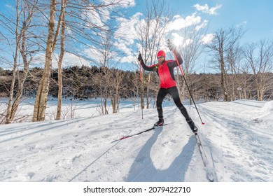 Man Cross Country Skate Skiing Style - Nordic Ski In Forest. Man In Winter Doing Fun Endurance Winter Sport Activity In The Snow On Cross Country Ski In Beautiful Nature Landscape.