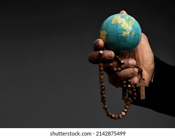 man with cross and globe praying to god on grey background stock photo