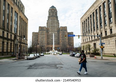 A Man Crosses The Street In Front Of City Hall In Buffalo, NY On Saturday, April 23, 2022.