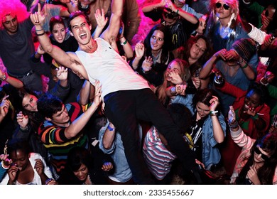 Man crowd surfing at music festival - Powered by Shutterstock