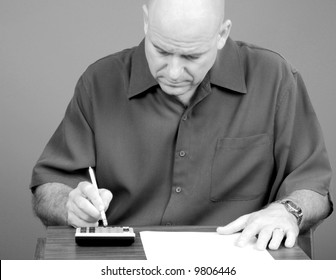 Man Crunching Numbers Working On Finances