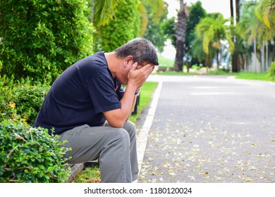 Man crying and thinking. - Shutterstock ID 1180120024