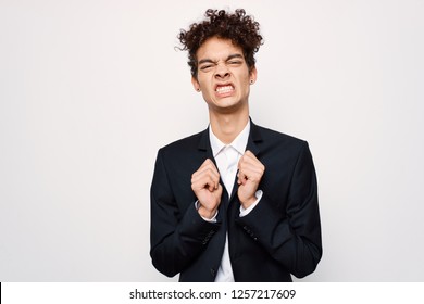 A Man With Curly Hair Gritted His Teeth                 