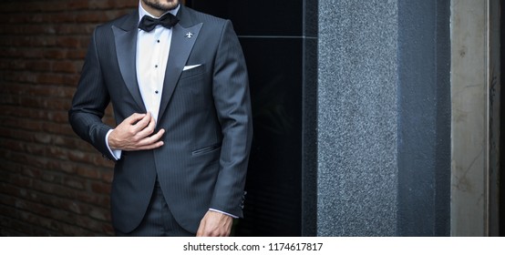 Man In Custom Expensive Tailored Tuxedo,suit Posing Outdoors