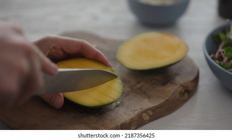 Man Cut Mango For Salad With Micro Greens And Mozzarella In Blue Bowl, Wide Photo