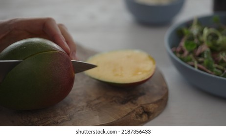 Man Cut Mango For Salad With Micro Greens And Mozzarella In Blue Bowl, Wide Photo