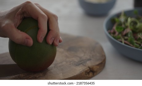 Man Cut Mango For Salad With Micro Greens And Mozzarella In Blue Bowl, Wide Photo