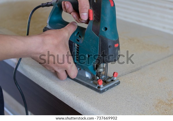 Man Cuts Countertop Furniture On Kitchen Stock Photo Edit Now