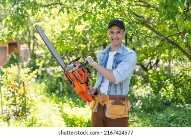 Man Cutting A Branch With Chainsaw