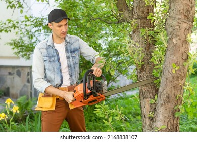 Man Cutting A Branch With Chainsaw