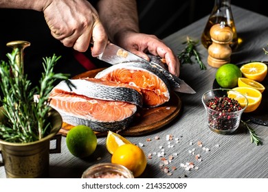 man cutting fresh salmon fillet. preparing restaurant dinner. Delicious gourmet seafood dish. banner, menu recipe place for text. - Powered by Shutterstock