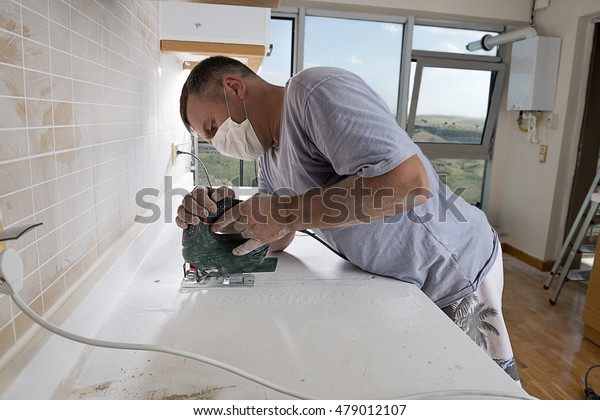 Man Cutting Kitchen Countertop Using Electric Stock Photo Edit