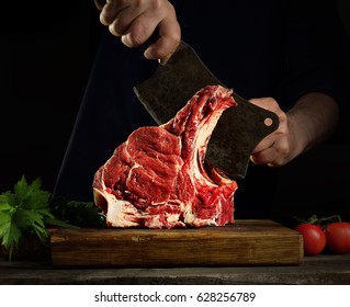 Man Cutting Raw Beef Meat.