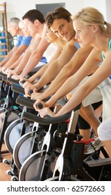 Man Cycling In Class In Gym