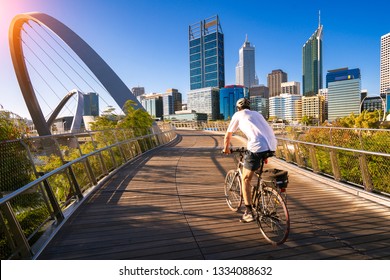 A man cycling on an elizabeth bridge in Perth city, western, Austrakia, this image can use for bike, sport, relax, healthy concept - Powered by Shutterstock