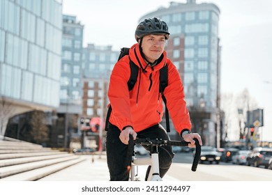 Man cycling through the city in bright attire, blending urban commute with fitness. - Powered by Shutterstock