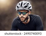 Man, cyclist and racing with helmet, sunglasses and cycling for sport, exercise and adventure. Male person, fitness and safety as athlete for training, physical activity and wellness on mountain road