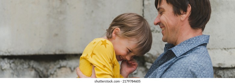 Man Dad Having Quality Time With Their Kid Son Boy Six Year Old On Arms. Happy Father Playing Together With Child. Real Life Authentic Day-to-day Fatherhood Moments. Fatherly Love Care. Banner