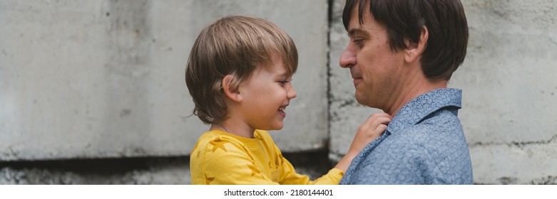 Man Dad Having Quality Time With Their Kid Son Boy Six Year Old On Arms. Happy Father Playing Together With Child. Real Life Authentic Day-to-day Fatherhood Moments. Fatherly Love Care. Banner