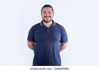 A man with a dad-bod. A stocky, barrel-chested physique. Wearing a blue polo shirt. Isolated on a white background. - Shutterstock ID 2148699885