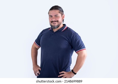 A man with a dad-bod. A stocky, barrel-chested physique. Wearing a blue polo shirt. Isolated on a white background. - Shutterstock ID 2148699889